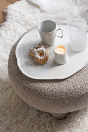 Pouf en tissu bouclé beige